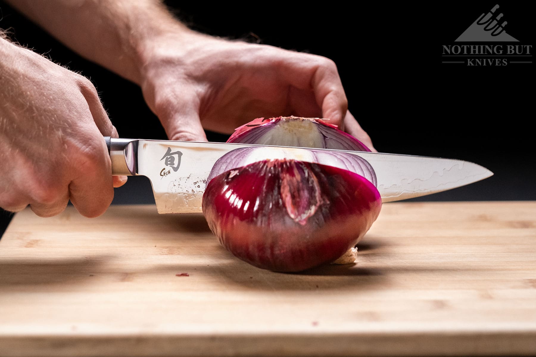 Slicing an onion with the Shun Sora chef knife.