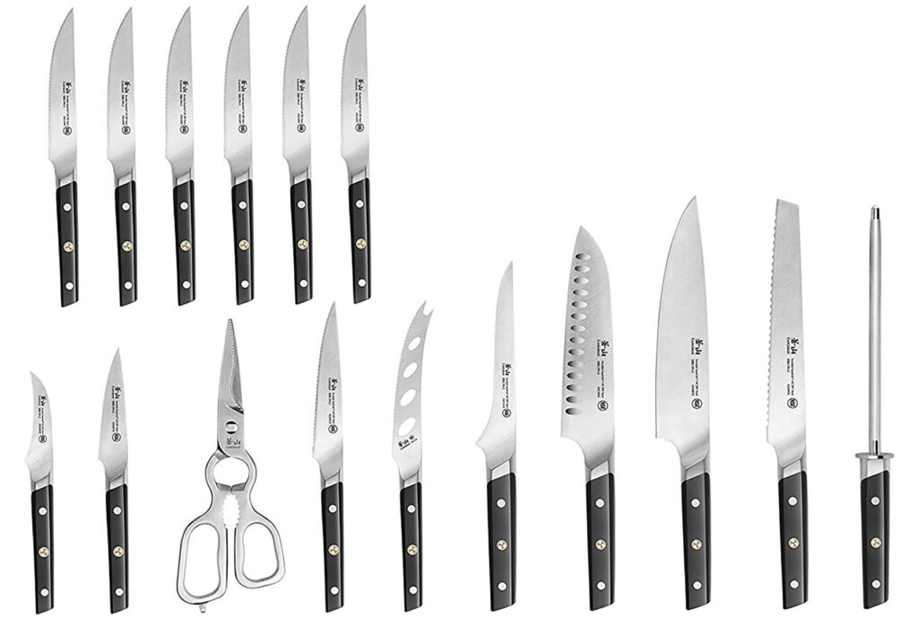 The 16 knives that are included in this Cangshan TC knife set on a white background. 