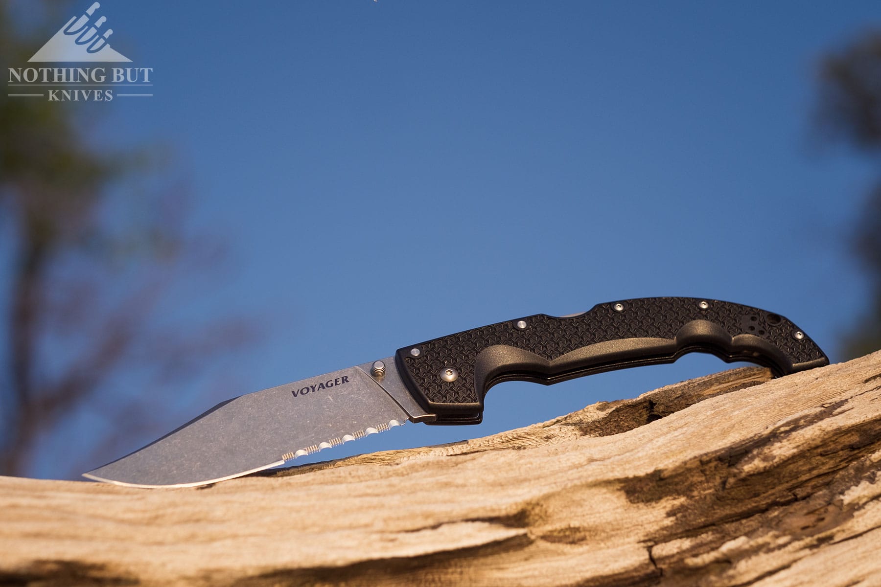 The Cold Steel Voyager XL folding knife in the open position tilted in a way that shows the blade edge.