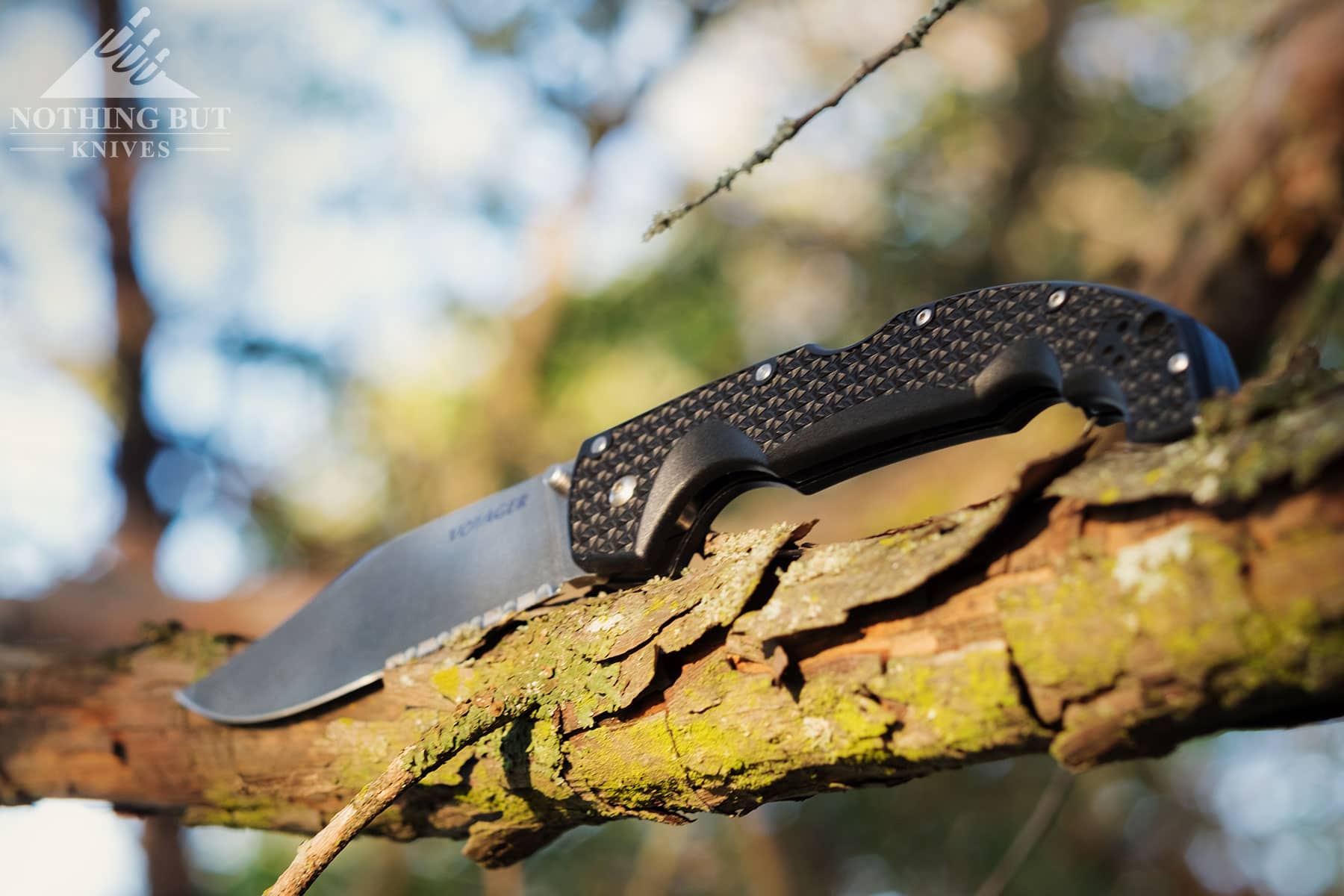The Cold Steel Voyager folding knife in the open position with the handle closest to the camera. 