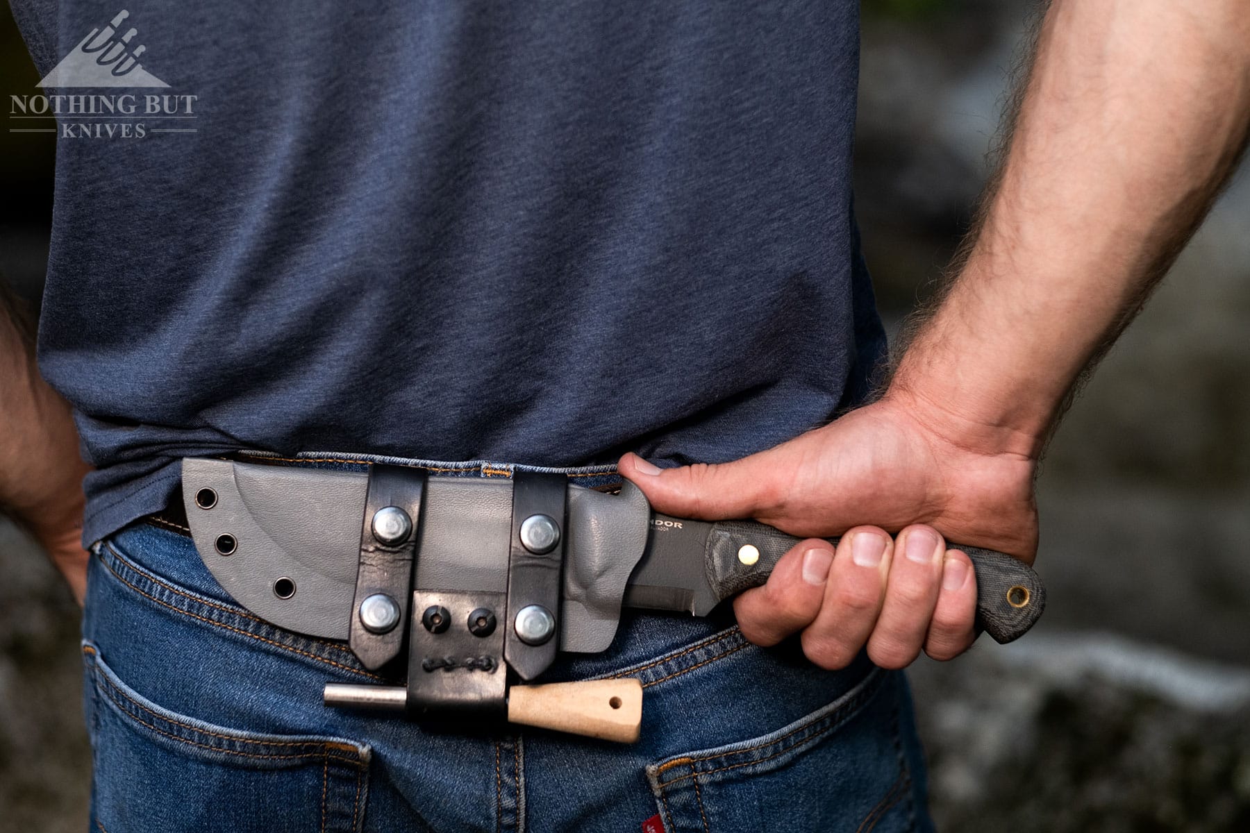 The Condor SBK in the scout carry position on a person's waist.