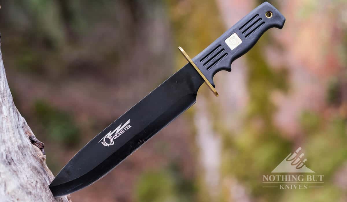 https://www.nothingbutknives.com/wp-content/uploads/2018/09/Frost-Cutlery-Quicksilver-Bowie-Knife-In-A-Stump.jpg