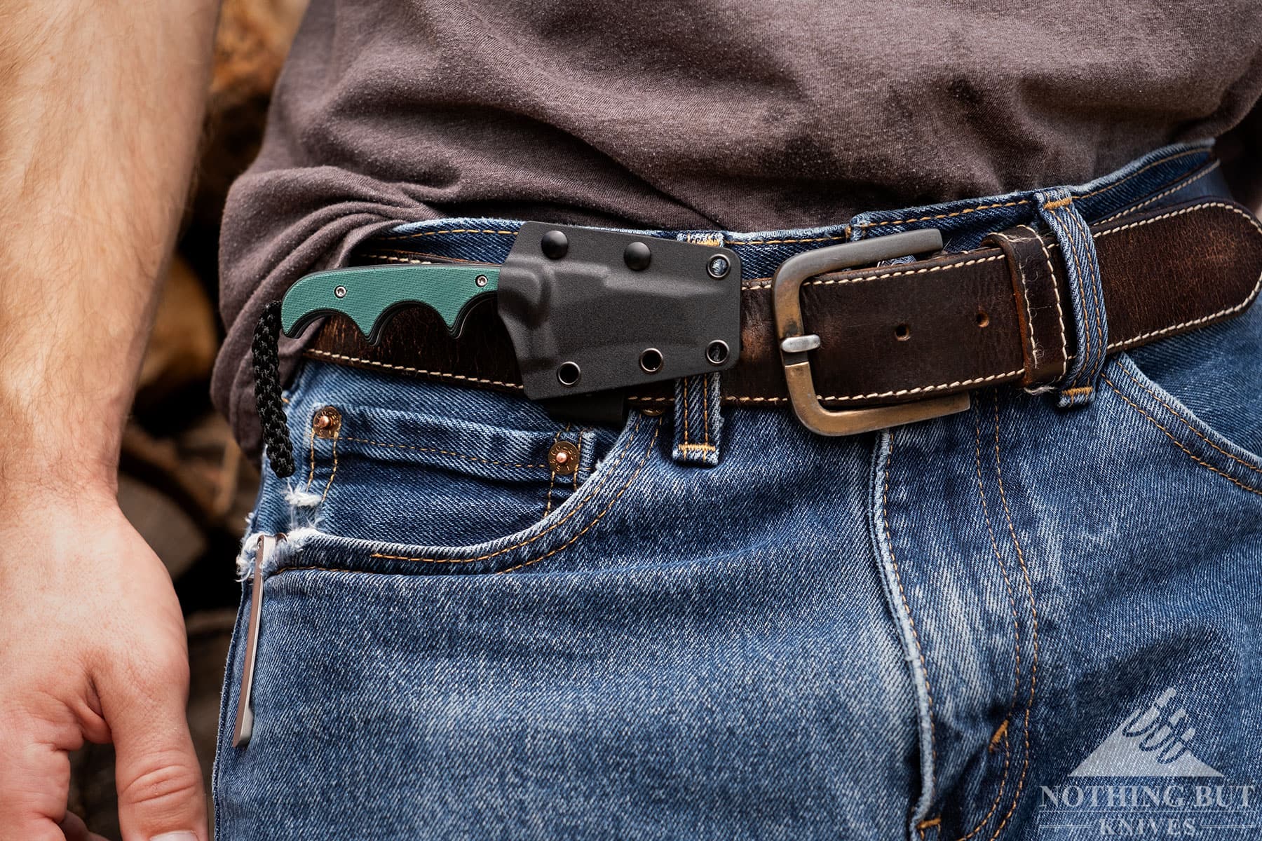 Wearing the CRKT Minimalist on a leather belt in the horizontal position. 