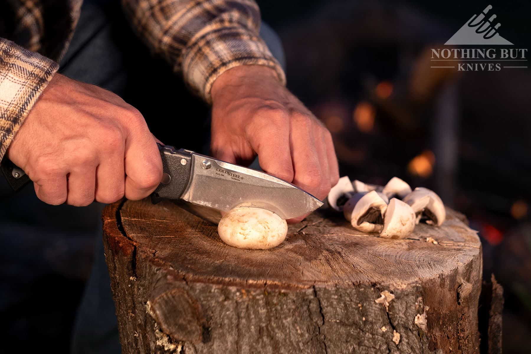 Slicing mushrooms at a campsite with the 4-MAX Scout pocket knife.