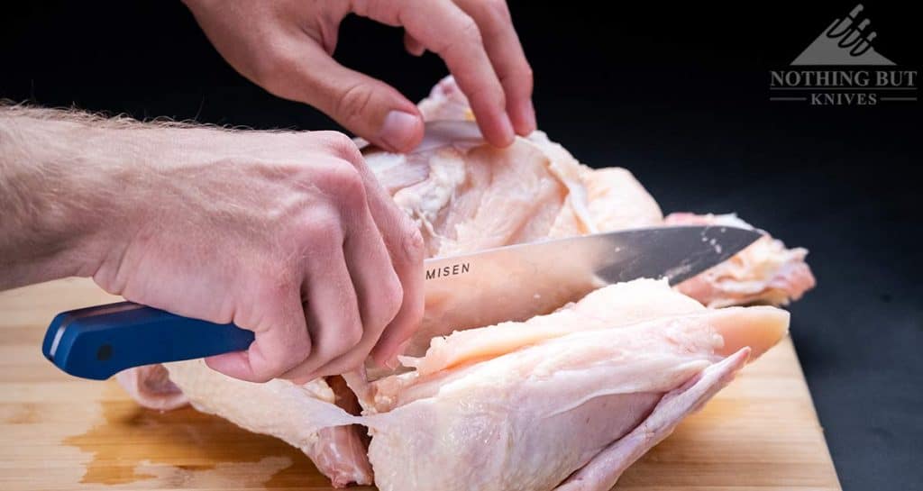 https://www.nothingbutknives.com/wp-content/uploads/2021/04/Cutting-Off-A-CHicken-Breast-With-The-Misen-Chef-Knife-1024x545.jpg