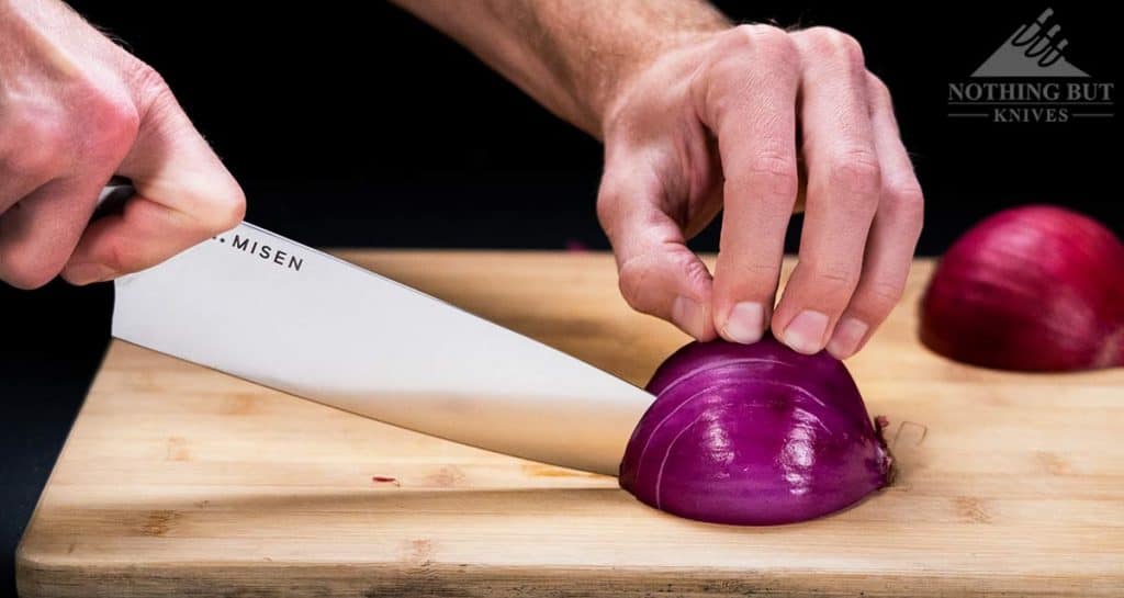 https://www.nothingbutknives.com/wp-content/uploads/2021/04/Slicing-An-Onion-With-The-Misen-Chef-Knife-1024x545.jpg