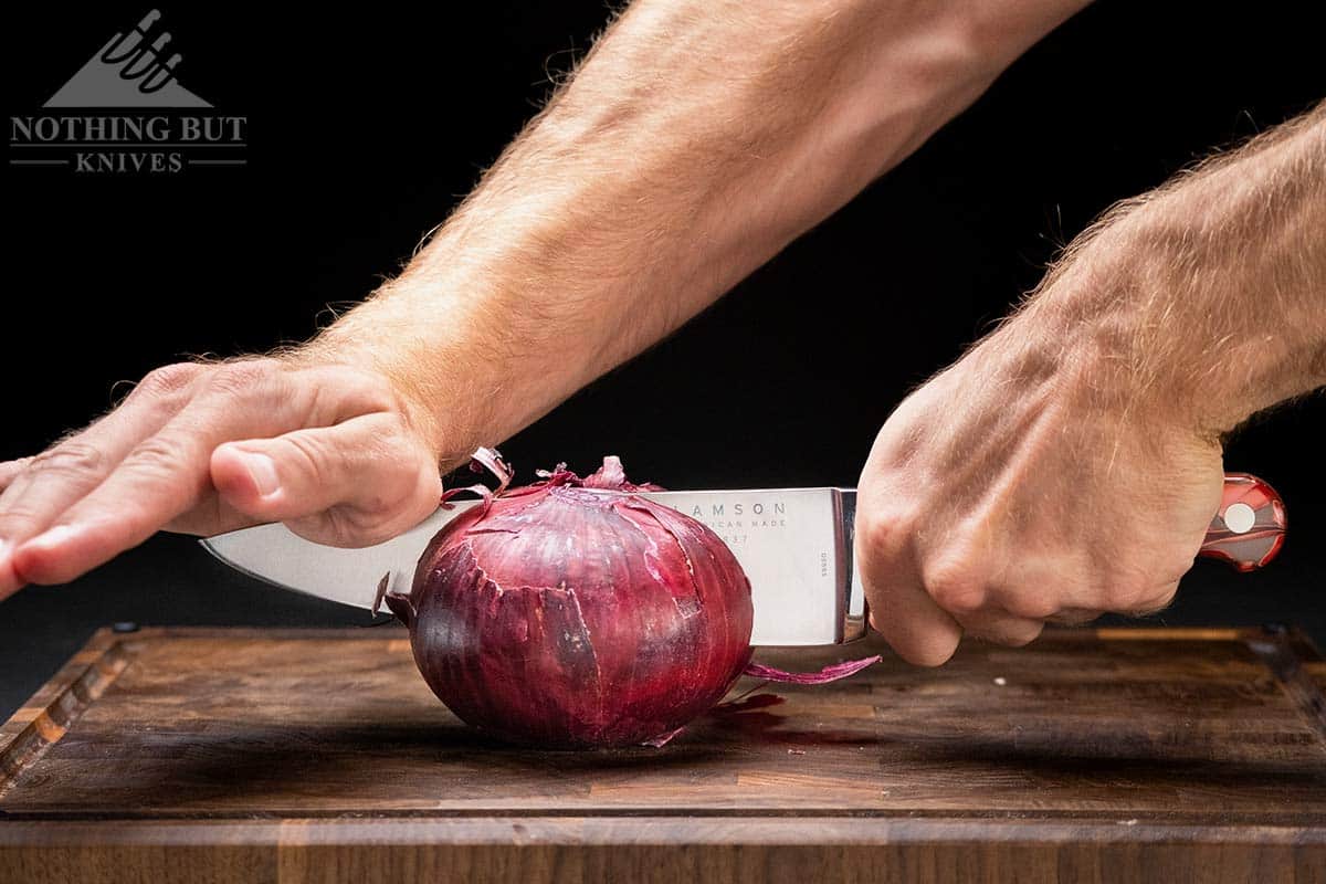 https://www.nothingbutknives.com/wp-content/uploads/2021/07/Cutting-A-Red-Onion-With-The-Lamson-Chef-Knife.jpg