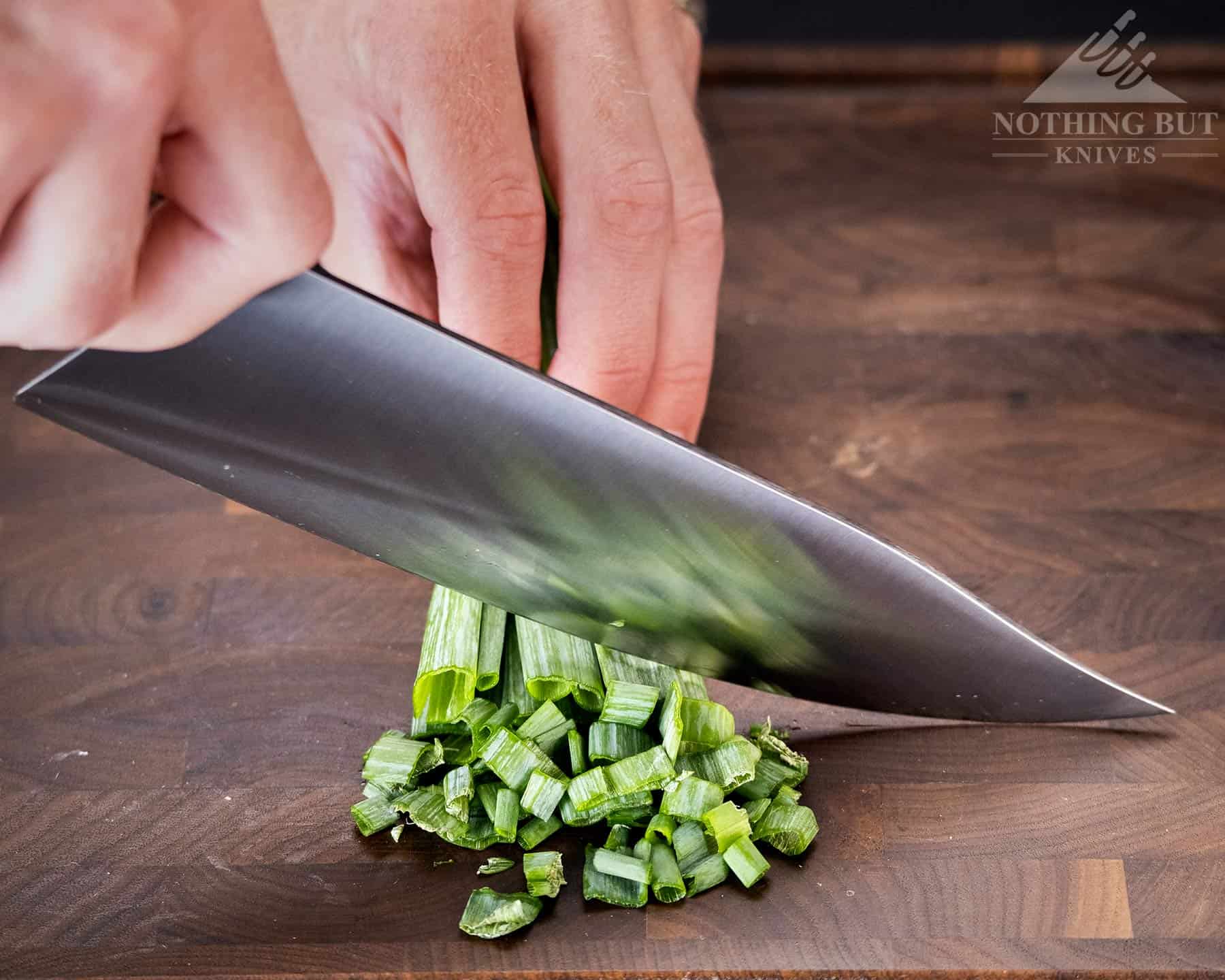 https://www.nothingbutknives.com/wp-content/uploads/2021/10/Mattia-Borrani-Chef-Knife-Chopping-Green-Onions-1.jpg