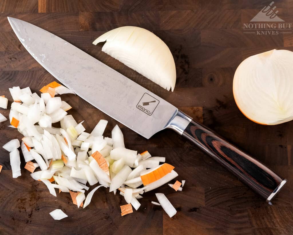 https://www.nothingbutknives.com/wp-content/uploads/2022/01/Imarku-8-Inch-Chef-Knife-With-Chopped-Onions-1024x819.jpg