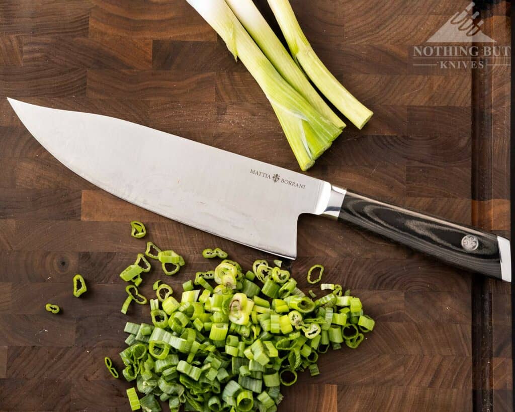 https://www.nothingbutknives.com/wp-content/uploads/2022/03/Mattia-Borrani-Chef-Knife-With-Chopped-Onions-1024x819.jpg