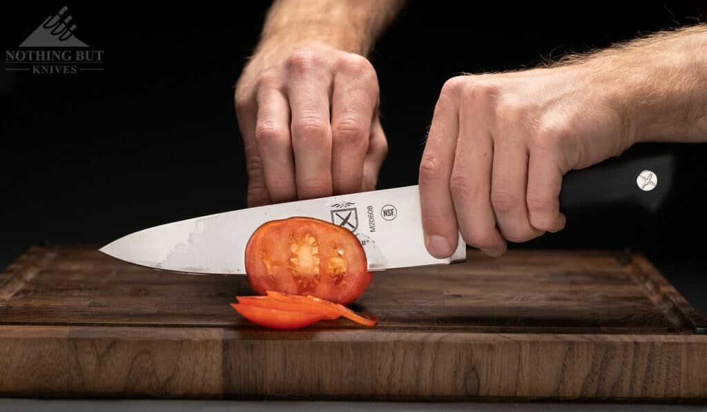 https://www.nothingbutknives.com/wp-content/uploads/2022/04/Slicing-A-Tomato-With-The-Mercer-Genesis-Chef-Knife-1024x597.jpg