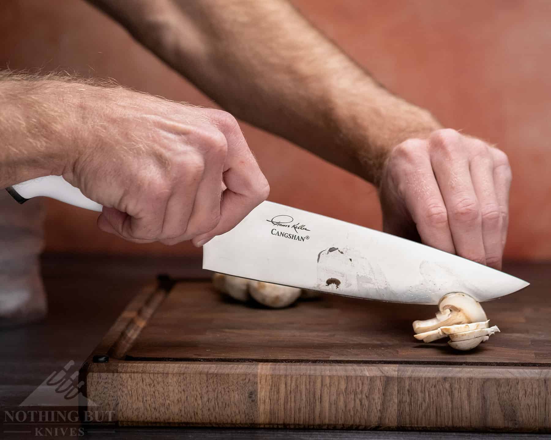 https://www.nothingbutknives.com/wp-content/uploads/2022/11/Slicing-Mushroom-With-the-Cangshan-Thomas-Keller-Chef-Knife.jpg