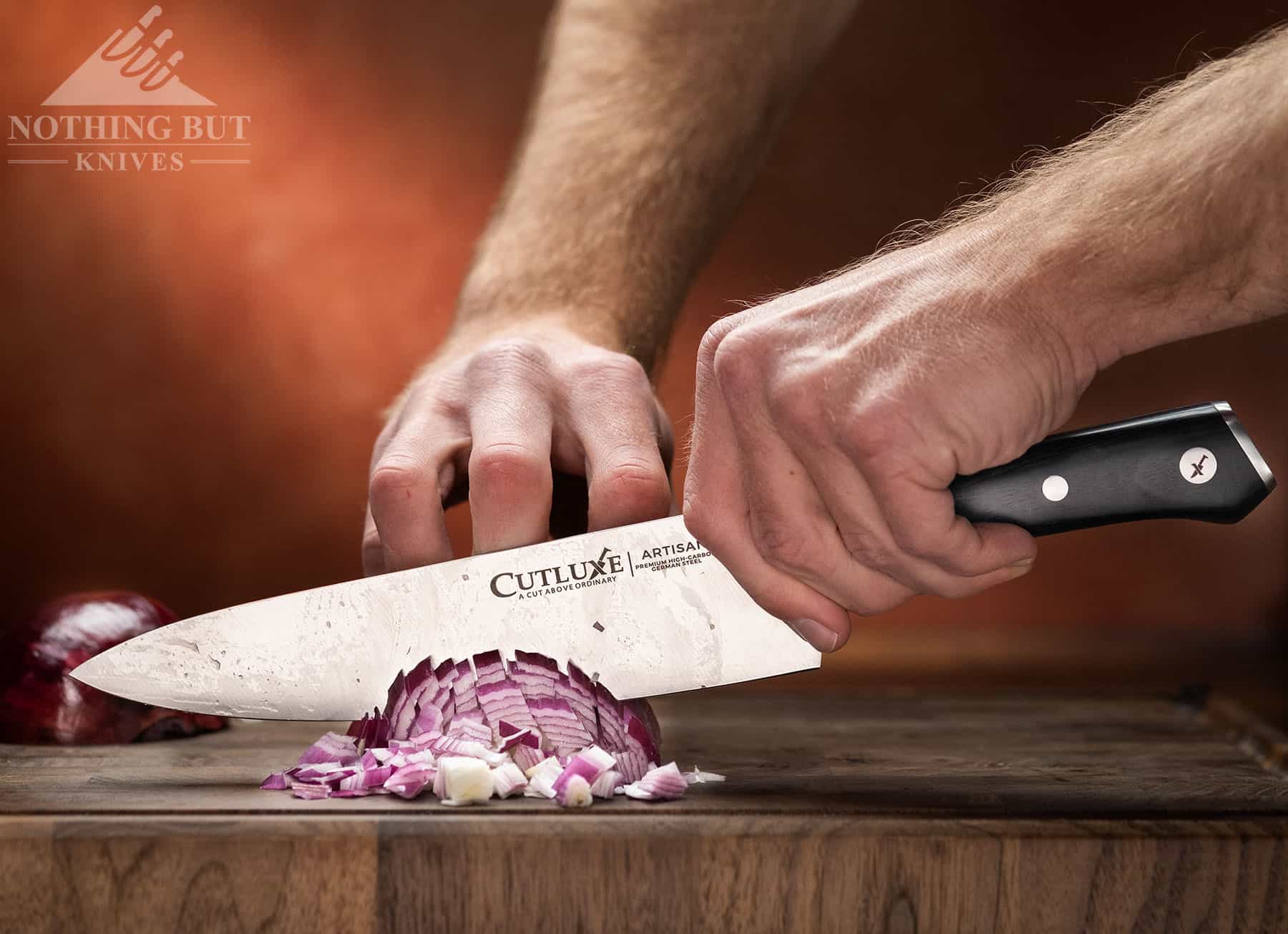 https://www.nothingbutknives.com/wp-content/uploads/2023/01/Dicing-Onions-with-a-Cutluxe-Artisan-Chef-Knife.jpg
