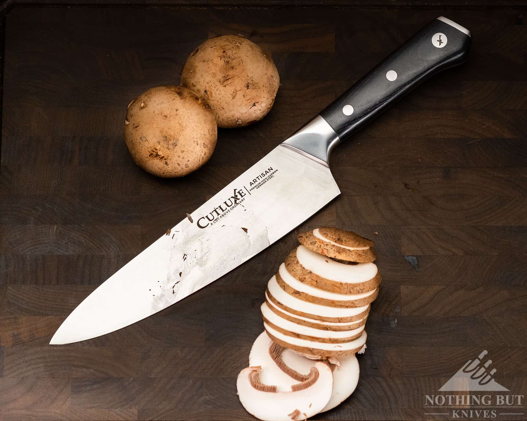 https://www.nothingbutknives.com/wp-content/uploads/2023/01/Home-Cooking-with-the-Cutluxe-Artisan-Chef-Knife.jpg