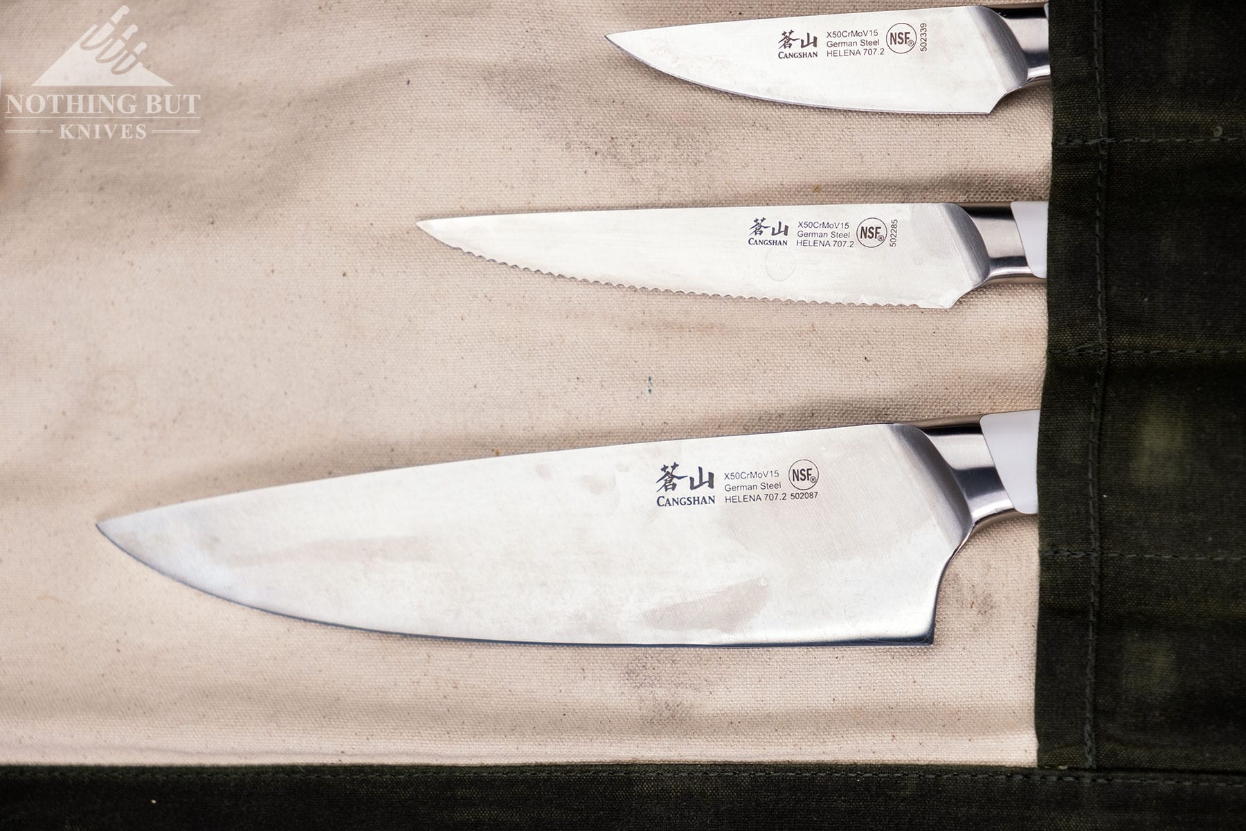 The three knives of the Cangshan Helena Starter Set with stained blades from corrosion. 