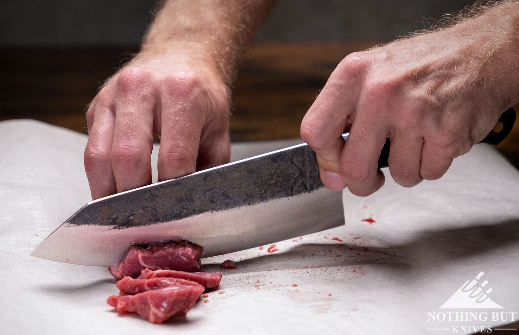 The Kitchen Perfection chef knife being used to slice beef.