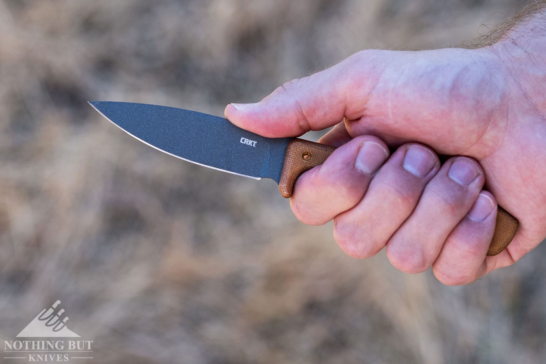 The CRKT Soldotna small fixed blade knife in a person's hand. 