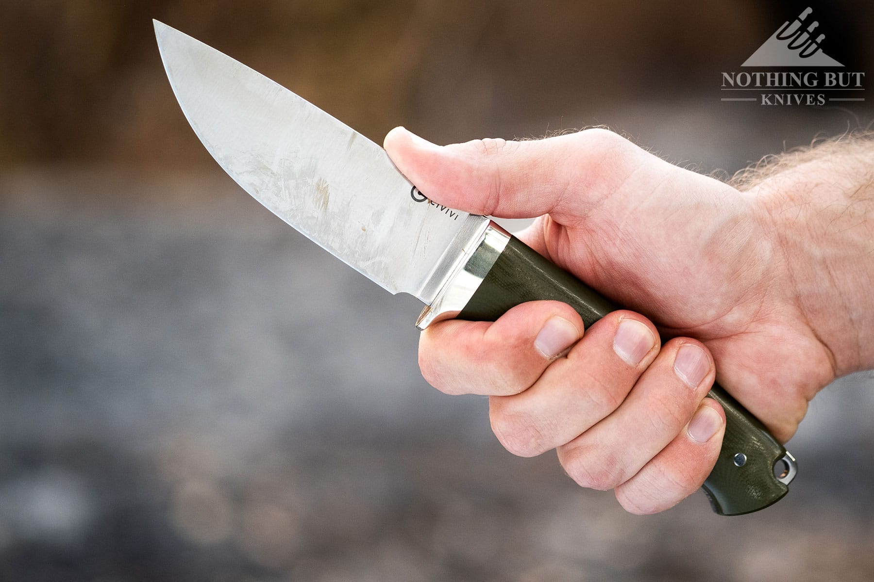 The Civivi Cloud Peak knife in the grip of a person's hand. 