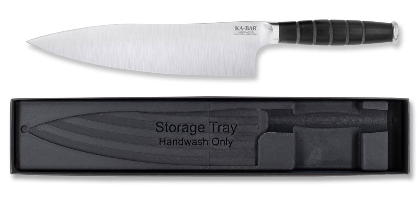 The 8-inch Ka-Bar chef knife shown here with its magnetized storage tray in front of a white background. 