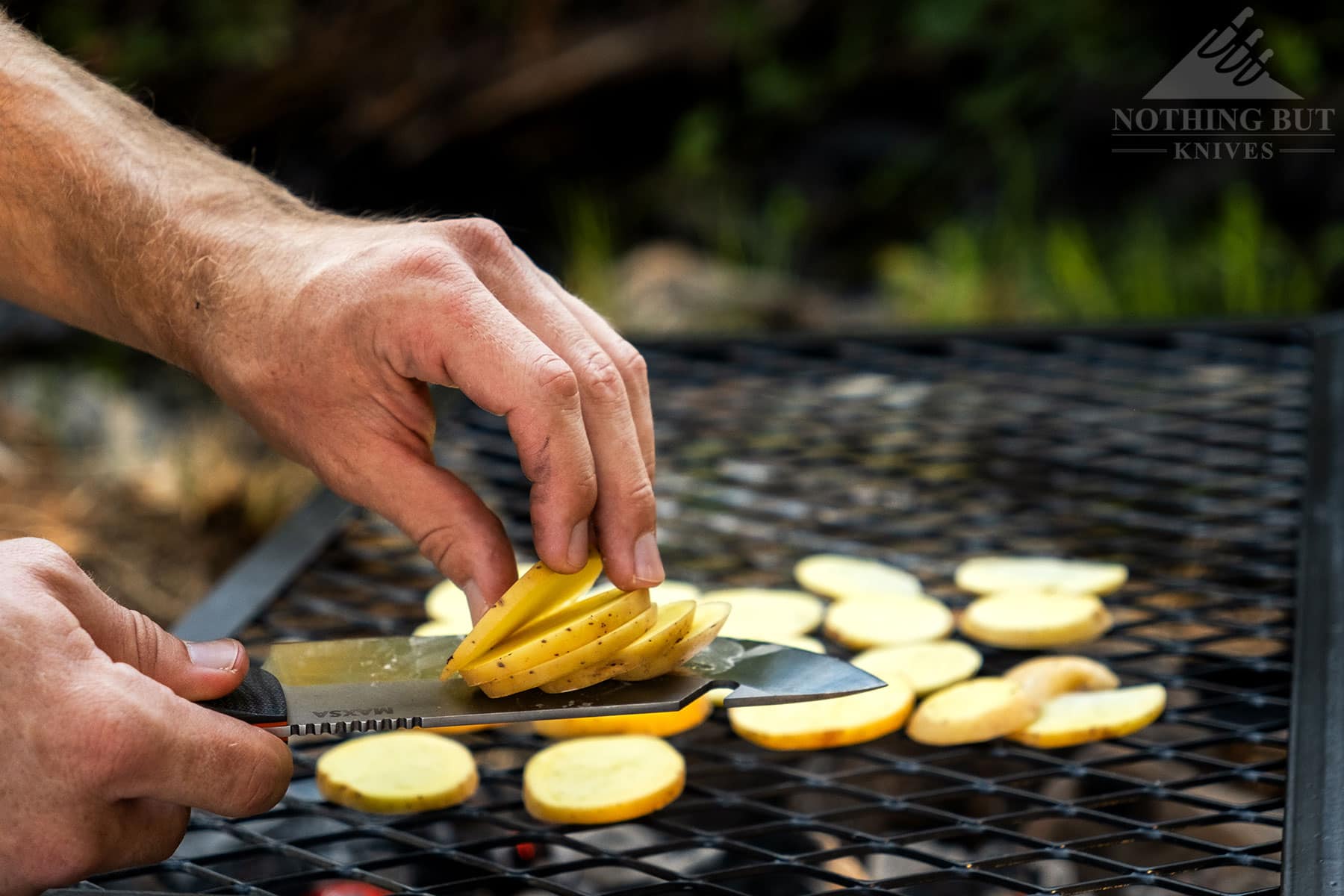 Dispensing potato slices with the Maxsa Blade camping chef knife.