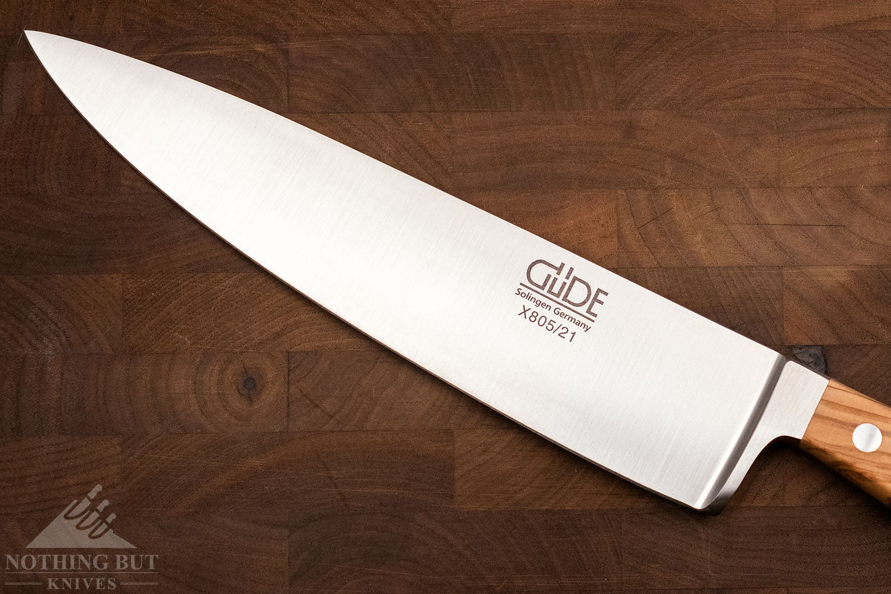 An overhead, close-up image of the Gude Alpha blade. 