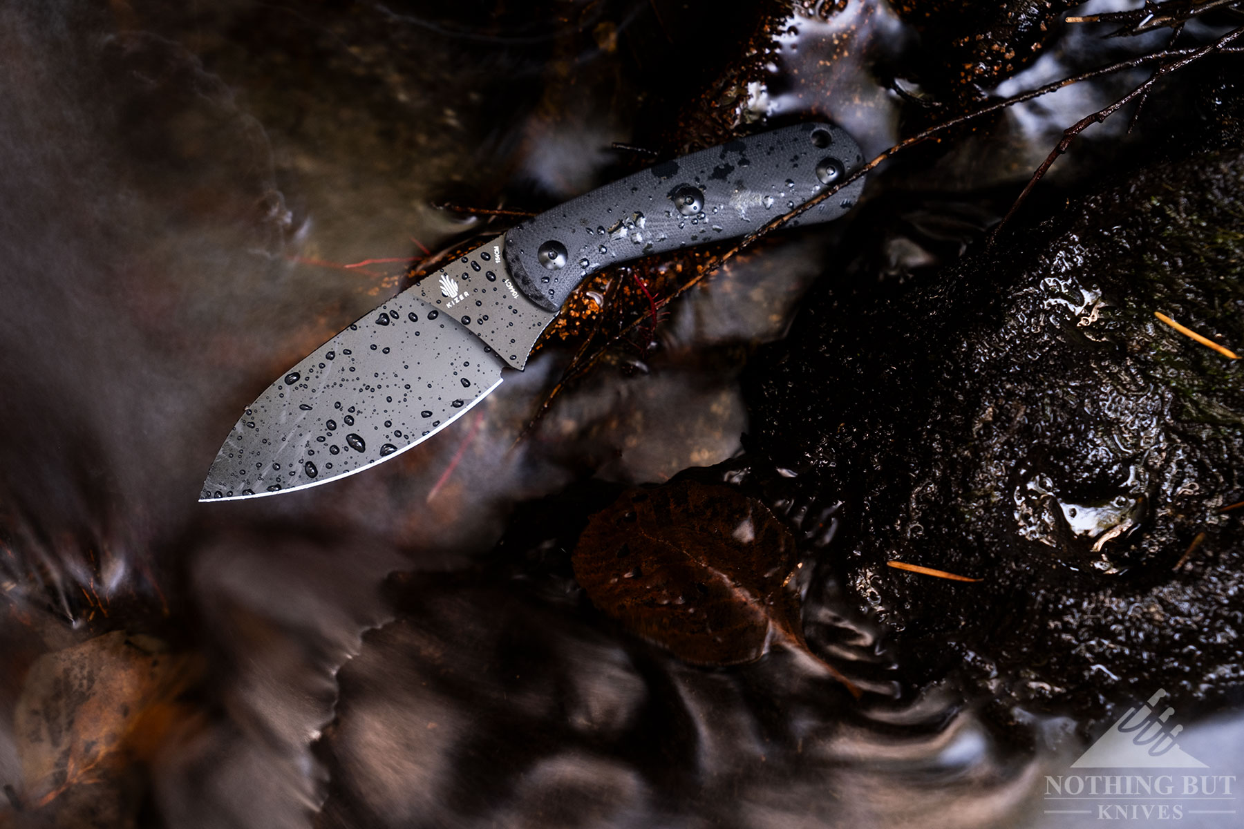 An overhead view of the Kizer Baby on top of rocks in a creek. 