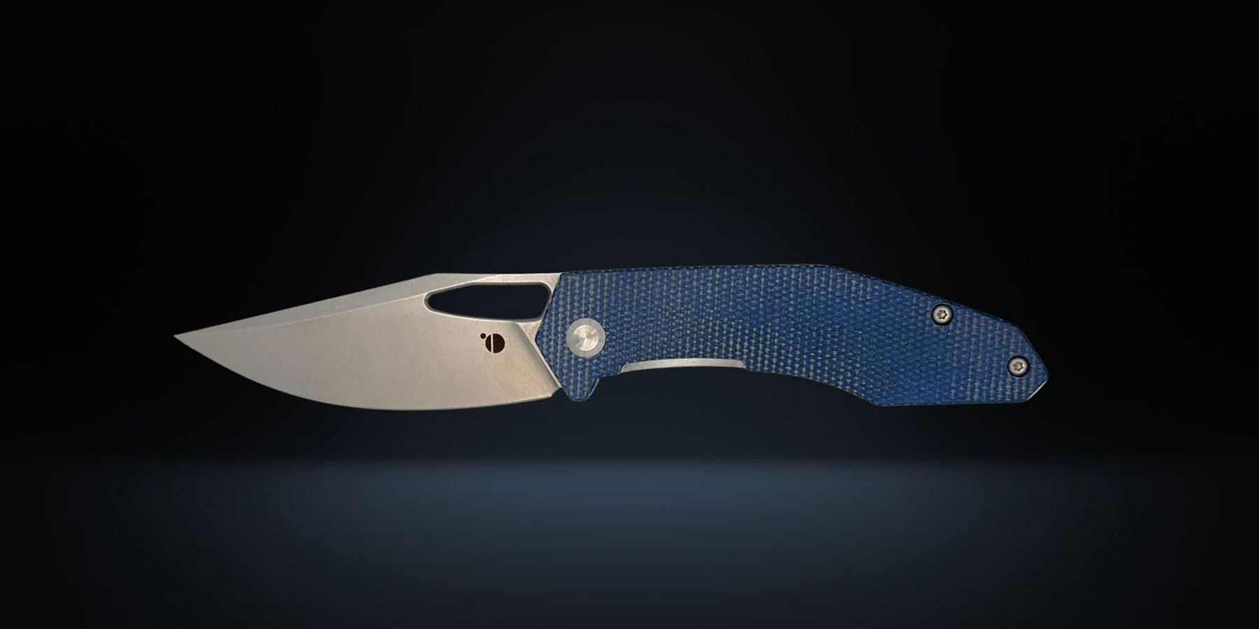 The Orbital Callisto pocket knife with its blade in the open position in front of a dark background.