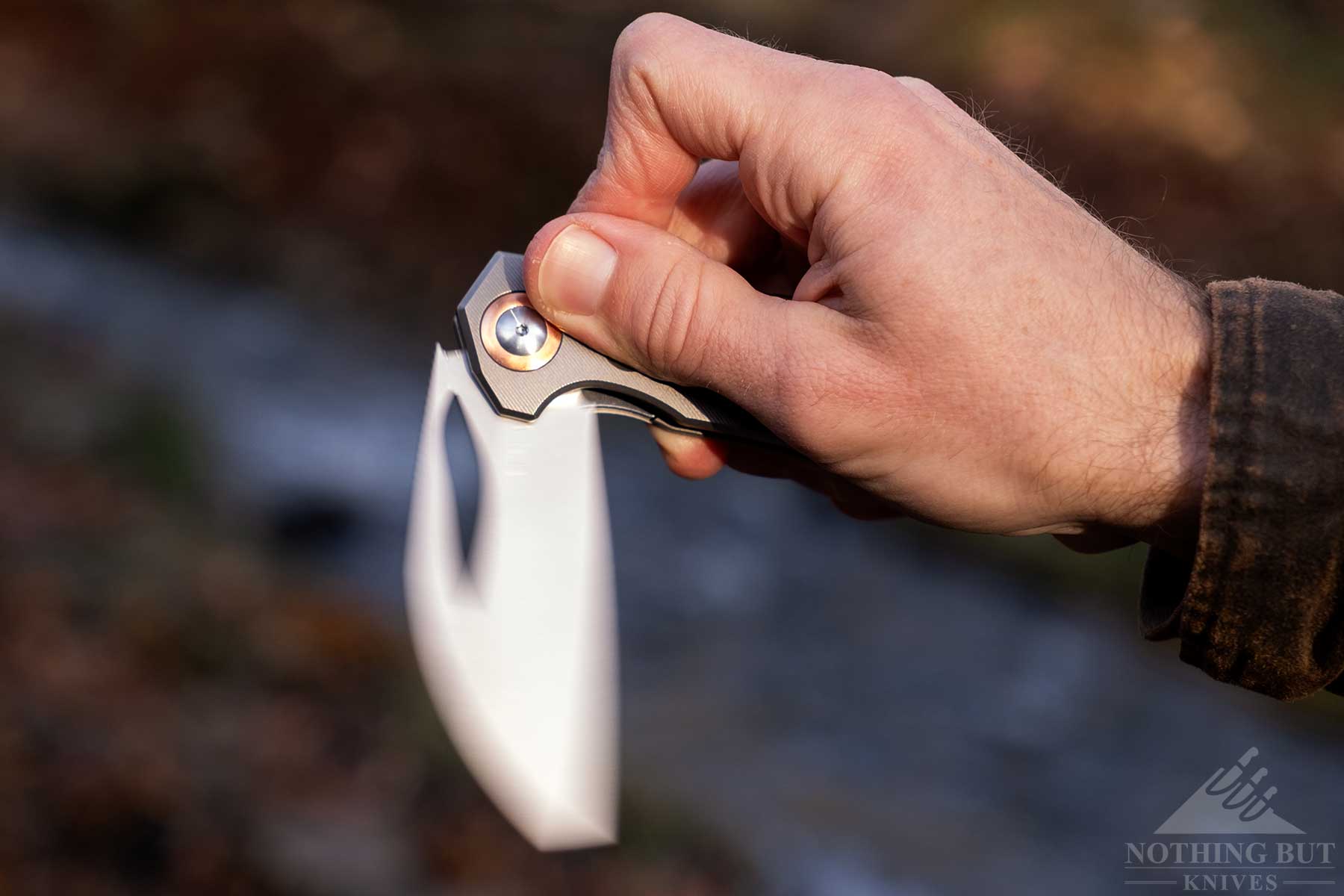 A close-up of the Kizer Hawk pocketknife being flipped open.